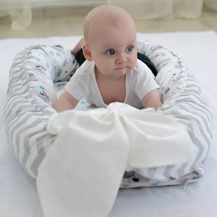 Nid d'ange bebe - réducteur de lit douillet™ - Espacebambin